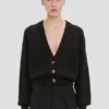 Strickjacke mit Zopfmuster und Taschen in Schwarz Strickjacke mit Zopfmuster und Taschen in Schwarz